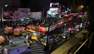 Ambulances and rescue workers arrive at the street near the scene of a crowd surge in Seoul, South Korea, Oct. 30, 2022. The Halloween party crush in Seoul has caused an outpouring of public sympathy toward the 150 dead, but there&#39;s also a strong level of embarrassment and anger from citizens toward the country that they say still ignores safety and regulatory issues. (AP Photo/Lee Jin-man, File)