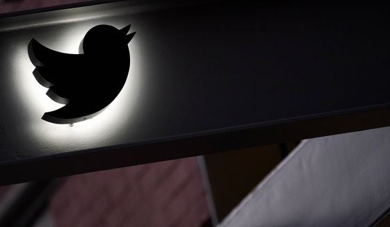 The Twitter logo is seen on the awning of the building that houses the Twitter office in New York, Wednesday, Oct. 26, 2022. Employees were bracing for widespread layoffs at Twitter Friday, Nov. 4,  as new owner Elon Musk overhauls the social platform.  (AP Photo/Mary Altaffer,file)