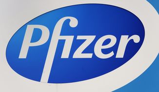 A Pfizer logo is shown at their global supply Kalamazoo manufacturing plant in Portage, Mich., on Dec. 11, 2020. (AP Photo/Paul Sancya, File)