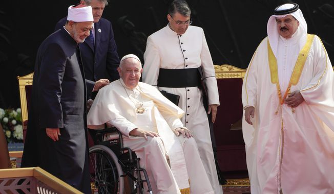 From left, Ahmed El-Tayeb, Grand Imam of al-Azhar, Pope Francis and Bahrain&#x27;s King Hamad bin Isa Al Khalifa attend the closing session of the &amp;quot;Bahrain Forum for Dialogue: East and west for Human Coexistence&amp;quot;, at the Al-Fida square at the Sakhir Royal palace, Bahrain, Friday, Nov. 4, 2022. Pope Francis is making the November 3-6 visit to participate in a government-sponsored conference on East-West dialogue and to minister to Bahrain&#x27;s tiny Catholic community, part of his effort to pursue dialogue with the Muslim world. (AP Photo/Hussein Malla)