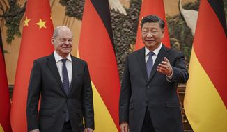Chinese President Xi Jinping, right, and German Chancellor Olaf Scholz meet at the Great Hall of the People in Beijing, China, Friday, Nov. 4, 2022. (Kay Nietfeld/Pool Photo via AP)