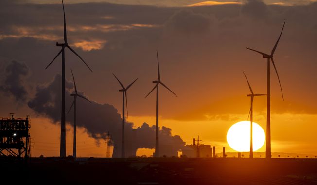 Steam rises from the coal-fired power plant with wind turbines nearby in Niederaussem, Germany, as the sun rises on Nov. 2, 2022. When world leaders, diplomats, campaigners and scientists descend on Sharm el-Sheikh in Egypt for talks on tackling climate change, don&#x27;t expect them to part the Red Sea or perform other miracles that would make huge steps in curbing global warming. (AP Photo/Michael Probst, File)