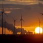 Steam rises from the coal-fired power plant with wind turbines nearby in Niederaussem, Germany, as the sun rises on Nov. 2, 2022. When world leaders, diplomats, campaigners and scientists descend on Sharm el-Sheikh in Egypt for talks on tackling climate change, don&#39;t expect them to part the Red Sea or perform other miracles that would make huge steps in curbing global warming. (AP Photo/Michael Probst, File)