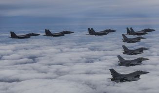 In this photo provided by South Korea Defense Ministry, South Korean Air Force&#39;s F15K fighter jets and U.S. Air Force&#39;s F-16 fighter jets, fly in formation during a joint drill in an undisclosed location in South Korea, Oct. 4, 2022. (South Korea Defense Ministry via AP, File)