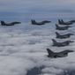 In this photo provided by South Korea Defense Ministry, South Korean Air Force&#39;s F15K fighter jets and U.S. Air Force&#39;s F-16 fighter jets, fly in formation during a joint drill in an undisclosed location in South Korea, Oct. 4, 2022. (South Korea Defense Ministry via AP, File)
