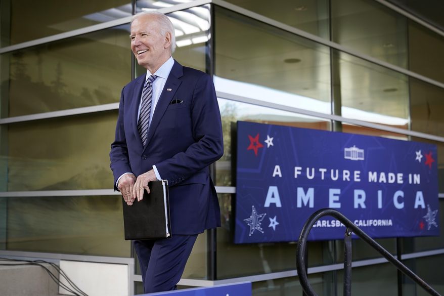 President Joe Biden smiles as he walks onto stage after being introduced by Taryne Haskamp to speak about the CHIPS and Science Act, a measure intended to boost the semiconductor industry and scientific research, at communications company ViaSat, Friday, Nov. 4, 2022, in Carlsbad, Calif. (AP Photo/Patrick Semansky)