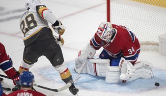 Montreal Canadiens goaltender Jake Allen stops Vegas Golden Knights&#x27; William Carrier (28) during the first period of an NHL hockey game Saturday, Nov. 5, 2022, in Montreal. (Graham Hughes/The Canadian Press via AP)