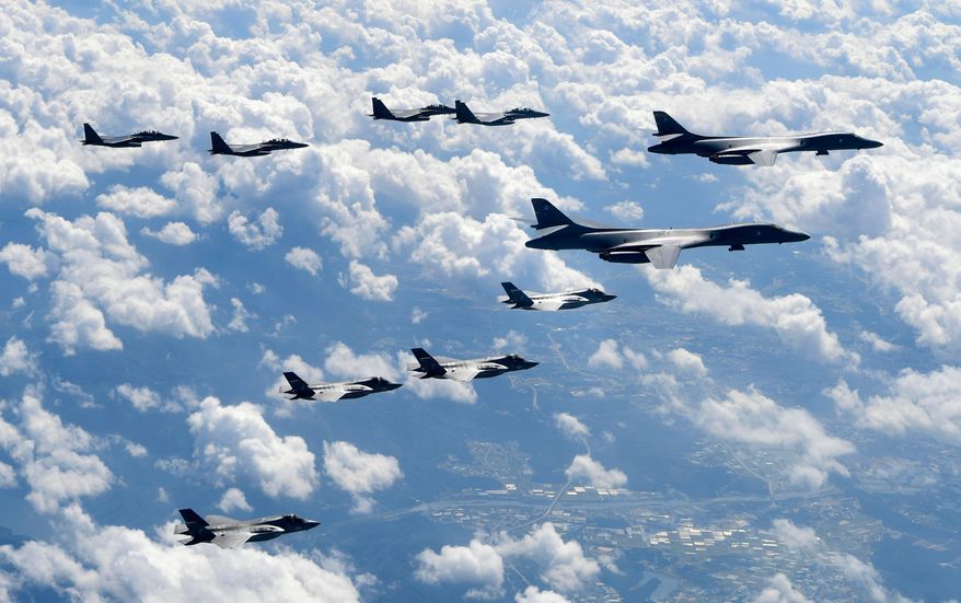 In this photo provided by South Korea Defense Ministry, U.S. Air Force B-1B bombers, F-35B stealth fighter jets and South Korean F-15K fighter jets fly over the Korean Peninsula during joint drills on Sept. 18, 2017. (South Korea Defense Ministry via AP, File)