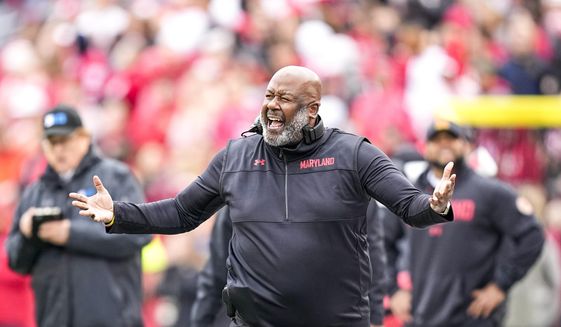 Maryland head coach Michael Locksley disputes a call during the second half of an NCAA college football game against Wisconsin, Saturday, Nov. 5, 2022, in Madison, Wis. (AP Photo/Andy Manis)