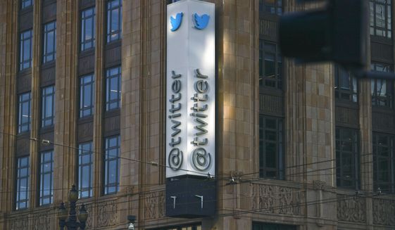 Twitter signage is seen outside Twitter headquarters on Friday, Nov. 4, 2022, in San Francisco. Twitter began widespread layoffs Friday as new owner Elon Musk overhauls the company, raising concerns about chaos enveloping the social media platform and its ability to fight disinformation just days ahead of the U.S. midterm elections. (Lea Suzuki/San Francisco Chronicle via AP)
