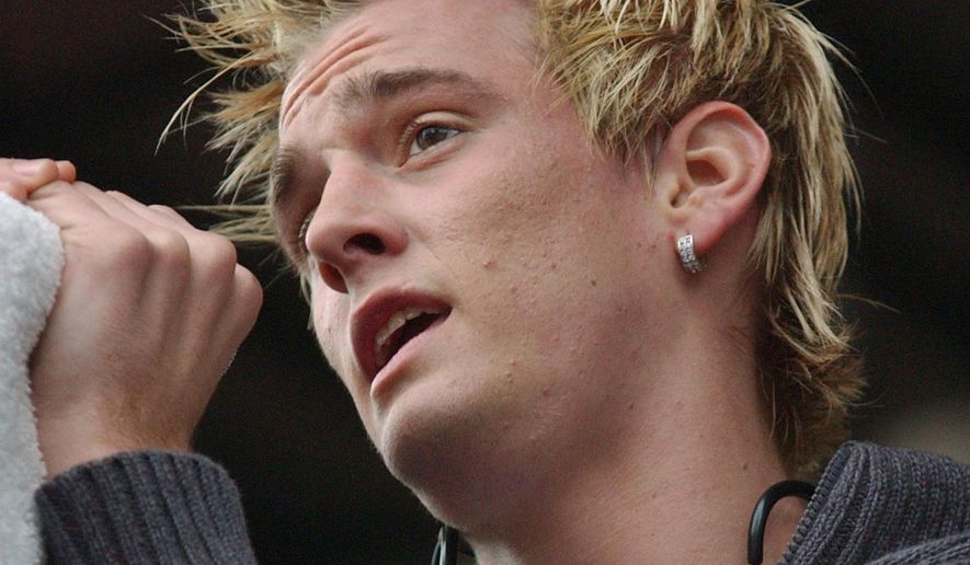 Singer Aaron Carter sings to a crowd during a First Night celebration at Government Center, on Dec. 31, 2004, in Boston. Carter, the singer-rapper who began performing as a child and had hit albums starting in his teen years, was found dead Saturday, Nov. 5, 2022, at his home in Southern California. He was 34. (AP Photo/Lisa Poole, File)
