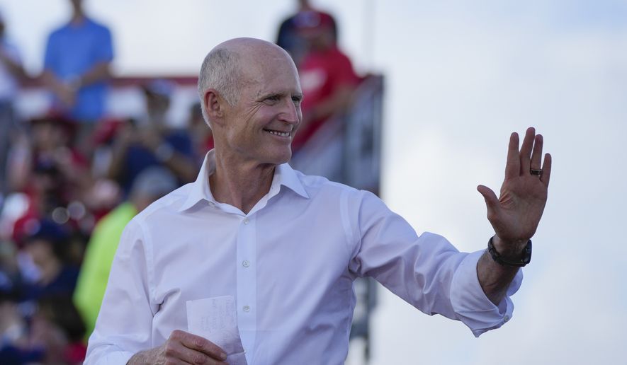 Sen. Rick Scott, R-Fla., arrives to speak before former President Donald Trump at a campaign rally in support of the campaign of Sen. Marco Rubio, R-Fla., at the Miami-Dade County Fair and Exposition on Sunday, Nov. 6, 2022, in Miami. (AP Photo/Rebecca Blackwell)