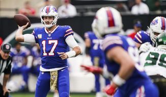 Buffalo Bills quarterback Josh Allen (17) throws a pass to Dawson Knox during the first half of an NFL football game against the New York Jets, Sunday, Nov. 6, 2022, in East Rutherford, N.J. (AP Photo/John Minchillo)