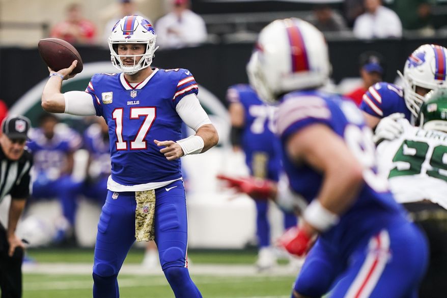Buffalo Bills quarterback Josh Allen (17) throws a pass to Dawson Knox during the first half of an NFL football game against the New York Jets, Sunday, Nov. 6, 2022, in East Rutherford, N.J. (AP Photo/John Minchillo)