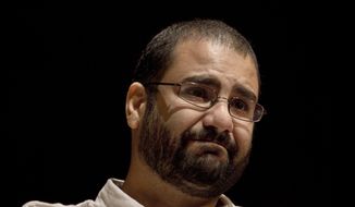 Egypt&#x27;s leading pro-democracy activist Alaa Abdel-Fattah speaks during a conference at the American University in Cairo, Egypt, Sept. 22, 2014. The head of Amnesty International says that the proceedings of COP27 will be stained by the death of Egypt&#x27;s leading rights activist on a hunger and water strike in prison if Egyptian authorities do not release him within days. Speaking in Cairo Sunday, Nov. 6, 2022 Amnesty&#x27;s chief said the government had no more than 72 hours to save Alaa Abdel-Fattah&#x27;s life. (AP Photo/Nariman El-Mofty, File)