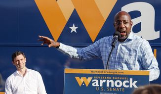 U.S. Sen. Raphael Warnock, D-Ga., speaks at a campaign event in Clarkston, Ga., on Thursday, Nov. 3, 2022. At left is U.S. Sen. Jon Ossoff, D-Ga. Herschel Walker and Sen. Raphael Warnock meet Tuesday, Nov. 8, in Georgia’s Senate contest that could help determine which party controls the Senate for the next two years. More than 2.5 million Georgia voters have already cast ballots, about a 20% increase over advanced voting in 2018. (AP Photo/Bob Andres, File)