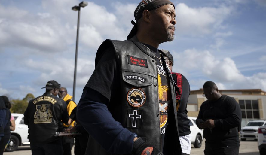 Rev. Alyn Waller of Enon Tabernacle Baptist Church looks on after rallying fellow bikers for a &amp;quot;Black Bikers Vote&amp;quot; procession, Saturday, Nov. 5, 2022, in Philadelphia. (AP Photo/Joe Lamberti)
