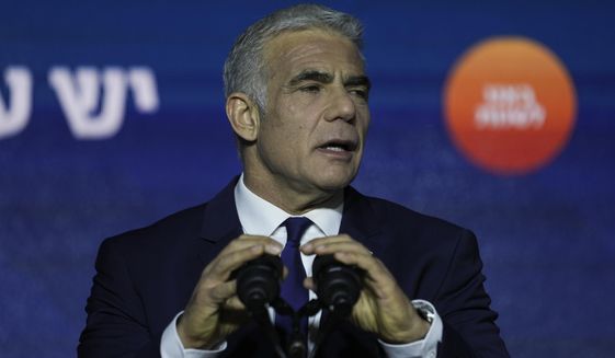 Israeli Prime Minister and the head of Yesh Atid party, Yair Lapid, speaks to his supporters after first exit poll results for the Israeli Parliamentary election at his party&#39;s headquarters in Tel Aviv, Israel, Nov. 2, 2022. Lapid issued a plea for national unity, on Sunday. Nov. 6, 2022, days after he was defeated in national elections by the former premier, Benjamin Netanyahu, with the backing of a far-right ultranationalist party. (AP Photo/Ariel Schalit, File)