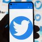 The Twitter logo is seen on a cell phone, Friday, Oct. 14, 2022, in Boston. (AP Photo/Michael Dwyer) ** FILE **