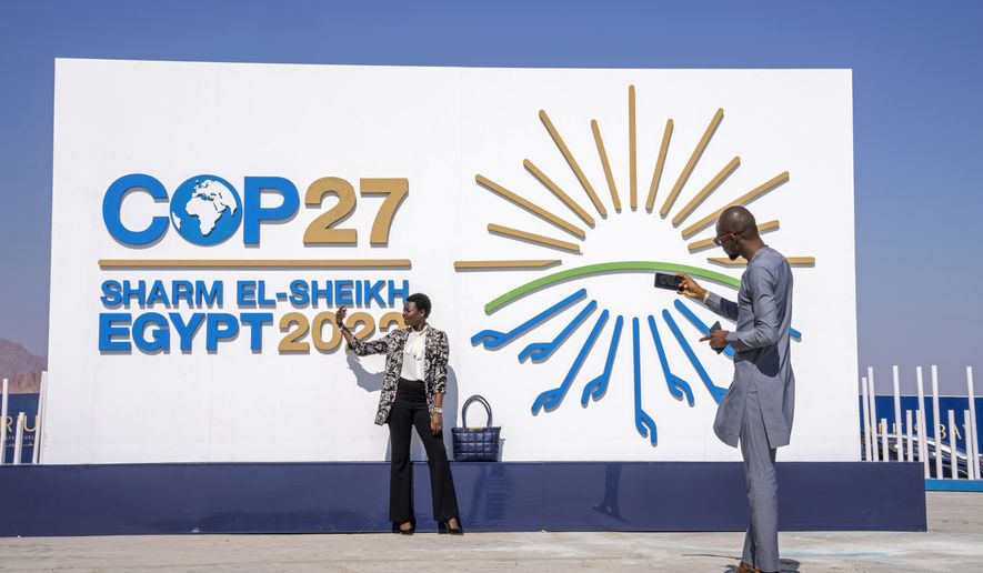 Chadians pose for a photograph at the entrance of the COP27 U.N. Climate Summit, Sunday, Nov. 6, 2022, in Sharm el-Sheikh, Egypt. Nearly 50 heads of state or governments on Monday will take the stage on the first day of “high-level” international climate talks in Egypt with more to come in the following days. (AP Photo/Nariman El-Mofty, File)