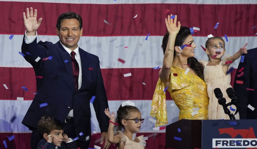 Incumbent Florida Republican Gov. Ron DeSantis, his wife Casey and their children on stage after speaking to supporters at an election night party after winning his race for reelection in Tampa, Fla., Tuesday, Nov. 8, 2022. (AP Photo/Rebecca Blackwell)