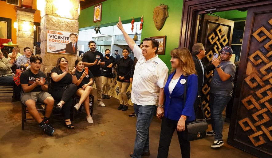 District 34 candidate U.S. Rep. Vicente Gonzalez and his wife, Lorena, enter his watch party to cheers Tuesday, Nov. 8, 2022, in Brownsville, Texas. (Denise Cathey/The Brownsville Herald via AP)
