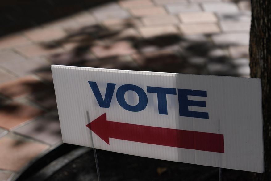 A sign that says "Vote" is placed outside of an early voting location Oct. 31, 2022, in Miami. Midterm elections are behind held on Nov. 8. (AP Photo/Lynne Sladky, File)