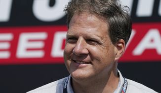 Governor Chris Sununu, R-N.H., smiles prior to the NASCAR Cup Series auto race at the New Hampshire Motor Speedway, Sunday, July 17, 2022, in Loudon, N.H. Sununu faces New Hampshire State Sen. Tom Sherman, a Democrat, in his re-election bid. (AP Photo/Charles Krupa)