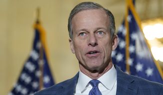 Sen. John Thune, R-S.D., talks with reporters on Capitol Hill in Washington, Jan. 20, 2022. Thune is running for his reelection in the Nov. 8 election. (AP Photo/Susan Walsh, File)