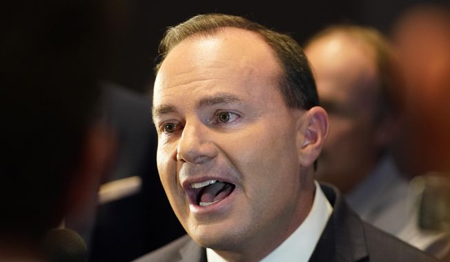 Utah Republican Sen. Mike Lee speaks to reporters during an election night party Tuesday, Nov. 8, 2022, in Salt Lake City. (AP Photo/Rick Bowmer) ** FILE **
