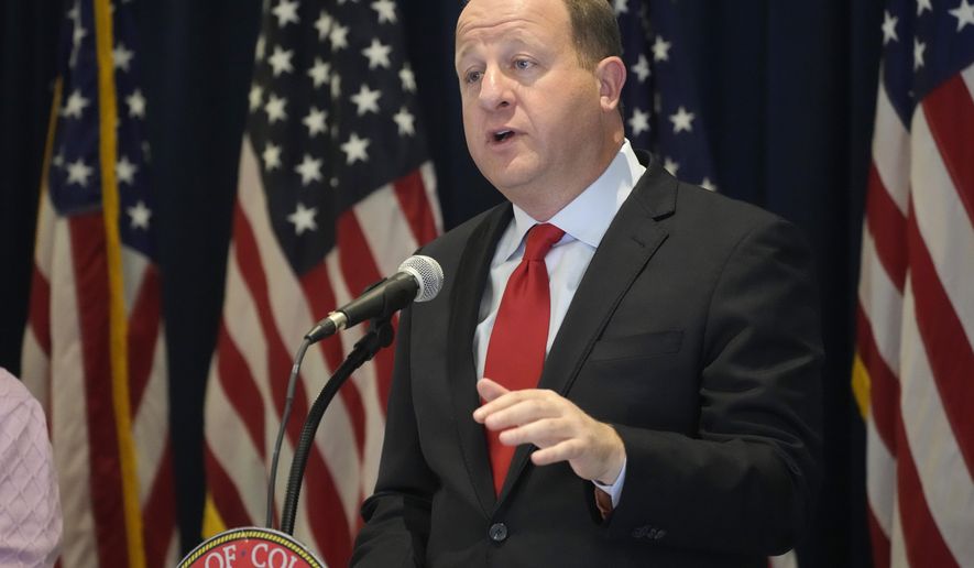 Colorado Gov. Jared Polis makes a point during a news conference after unveiling his balanced state budget proposal for fiscal year 2023-24 Tuesday, Nov. 1, 2022. Polis, a Democrat, is seeking reelection in the Nov. 8, election. (AP Photo/David Zalubowski, File)