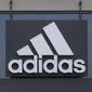 A sign is displayed in front of an Adidas retail store in Paramus, N.J., Tuesday, Oct. 25, 2022. Adidas has ended its partnership with the rapper formerly known as Kanye West over his offensive and antisemitic remarks, the latest company to cut ties with Ye and a decision that the German sportswear company said would hit its bottom line. (AP Photo/Seth Wenig) ** FILE **