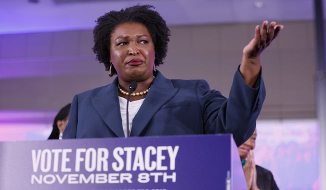 Stacey Abrams, the Democratic candidate for Governor of Georgia, speaks to supporters on election night watch party at a hotel in Atlanta on Tuesday, Nov. 8, 2022. Abrams has conceded and called Bryan Kemp to congratulate him. (Miguel Martinez/Atlanta Journal-Constitution via AP) **FILE**