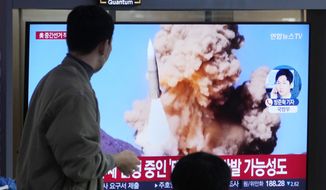 A TV screen shows a file image of North Korea&#39;s missile launch during a news program at the Seoul Railway Station in Seoul, South Korea, Wednesday, Nov. 9, 2022. (AP Photo/Ahn Young-joon) ** FILE **