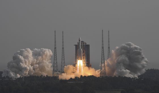 In this photo released by Xinhua News Agency, the Long March-5B Y4 carrier rocket carrying the space lab module Mengtian blasts off from the Wenchang Satellite Launch Center in south China&#39;s Hainan Province on Oct. 31, 2022. Philippine officials said Wednesday, Nov. 9, 2022, suspected debris from a recent Chinese rocket launch has been found at sea off two provinces and they were pressing efforts for Manila to ratify two U.N. treaties that allow people to seek compensation for damage or injury from space launches. (Hu Zhixuan/Xinhua via AP, File)