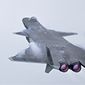 In this photo released by Xinhua News Agency, a J-20 stealth fighter jet performs an afterburner during the 14th China International Aviation and Aerospace Exhibition in Zhuhai in southern China&#39;s Guangdong province, Tuesday, Nov. 8, 2022. China is displaying its latest generation fighter jets and civilian aircraft this week as it looks to carve a larger role for itself in the global arms trade and compete with Boeing and Airbus. (Deng Hua/Xinhua via AP)