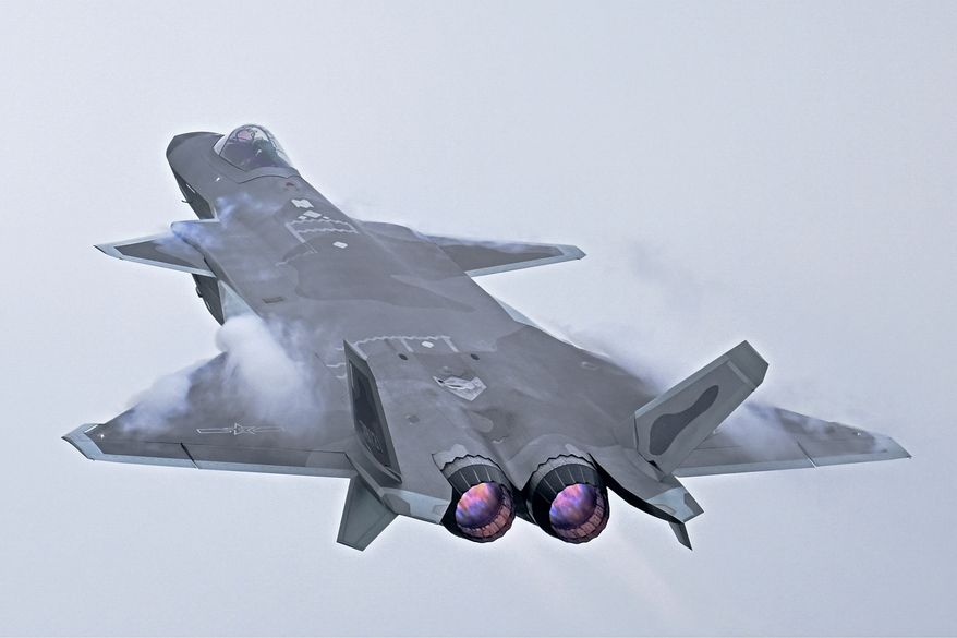 In this photo released by Xinhua News Agency, a J-20 stealth fighter jet performs an afterburner during the 14th China International Aviation and Aerospace Exhibition in Zhuhai in southern China&#x27;s Guangdong province, Tuesday, Nov. 8, 2022. China is displaying its latest generation fighter jets and civilian aircraft this week as it looks to carve a larger role for itself in the global arms trade and compete with Boeing and Airbus. (Deng Hua/Xinhua via AP)
