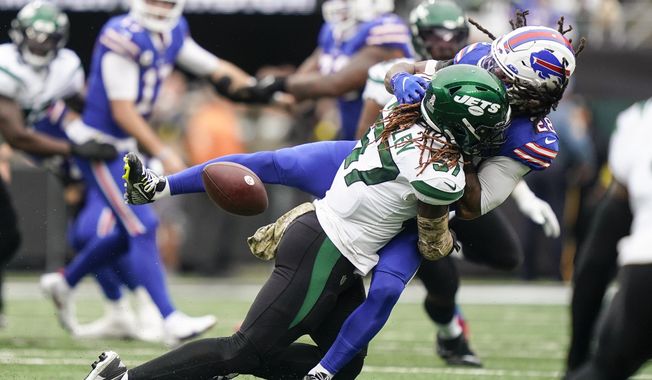 New York Jets linebacker C.J. Mosley (57) hits Buffalo Bills running back James Cook (28) during the first half of an NFL football game, Sunday, Nov. 6, 2022, in East Rutherford, N.J. (AP Photo/John Minchillo) **FILE**