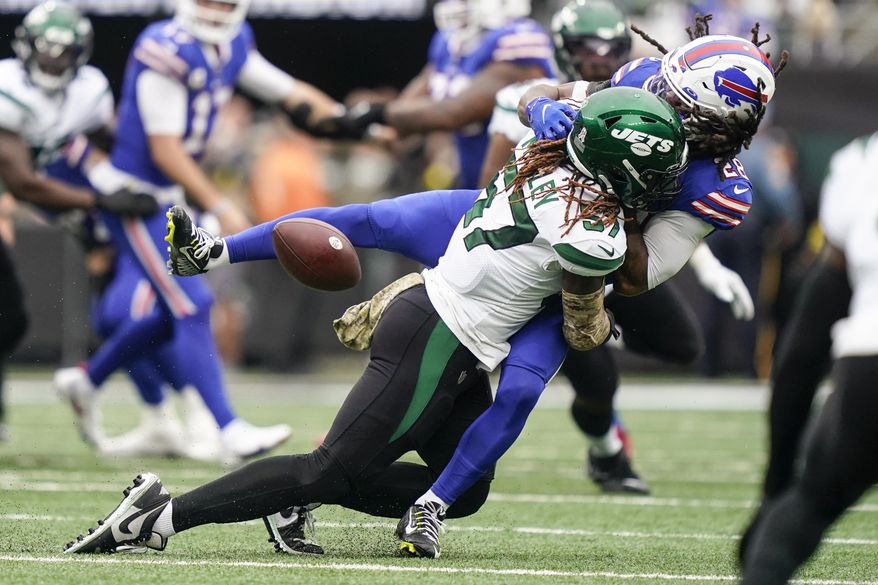 New York Jets linebacker C.J. Mosley (57) hits Buffalo Bills running back James Cook (28) during the first half of an NFL football game, Sunday, Nov. 6, 2022, in East Rutherford, N.J. (AP Photo/John Minchillo) **FILE**