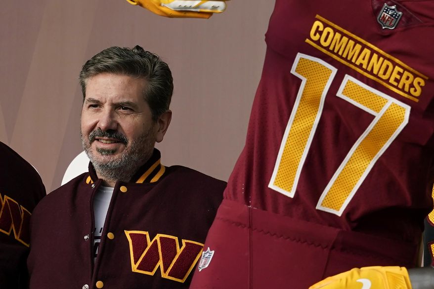 Washington Commanders&#x27; Dan Snyder poses for photos during an event to unveil the NFL football team&#x27;s new identity, Feb. 2, 2022, in Landover, Md. Snyder and his organization are the subject of multiple ongoing investigations over workplace misconduct and potential financial improprieties. The D.C. attorney general opened an investigation into the team around the time the U.S. House Committee for Oversight and Reform referred its case to the Federal Trade Commission. (AP Photo/Patrick Semansky, File)