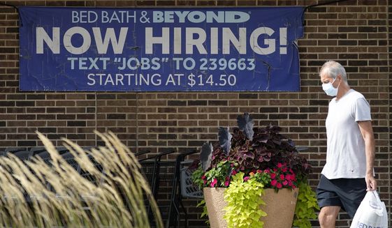 Hiring sign is displayed in Deerfield, Ill., Wednesday, Sept. 21, 2022.  Labor Department releases weekly report on unemployment benefits on Thursday, Nov. 10. (AP Photo/Nam Y. Huh)
