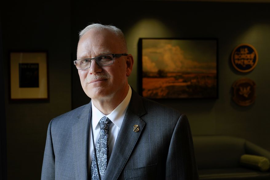 U.S. Customs and Border Protection Commissioner Chris Magnus poses for a photograph during an interview in his office with The Associated Press, Feb. 8, 2022, in Washington. (AP Photo/Patrick Semansky, File)