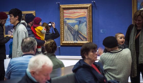 FILE - People look at Edvard Munch&#39;s &quot;The Scream&quot; at the National Gallery in Oslo, Norway, Sunday Jan. 13, 2019. On Friday, Nov. 11, 2022, activists from the organization &#39;&#39;Stopp oljeletinga&#39;&#39; (Stop Oil Exploration) tried to glue themselves to the frame of the painting. (Heiko Junge/NTB Scanpix via AP, file)