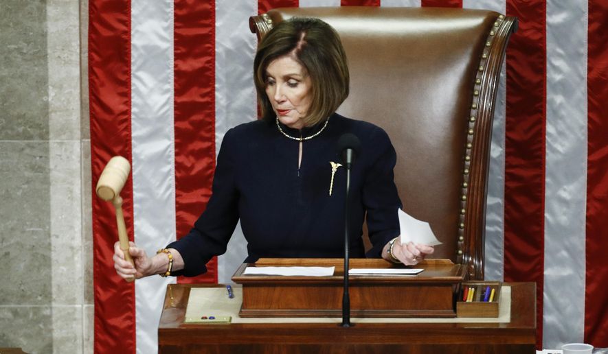 House Speaker Nancy Pelosi of Calif., strikes the gavel after announcing the passage of article II of impeachment against President Donald Trump, Dec. 18, 2019, on Capitol Hill in Washington. (AP Photo/Patrick Semansky, File)