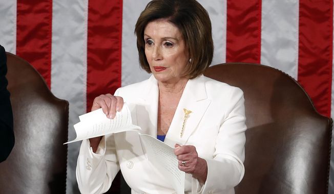 FILE - House Speaker Nancy Pelosi of Calif., tears her copy of President Donald Trump&#x27;s State of the Union address after he delivered it to a joint session of Congress on Capitol Hill in Washington, Feb. 4, 2020. (AP Photo/Alex Brandon, File)