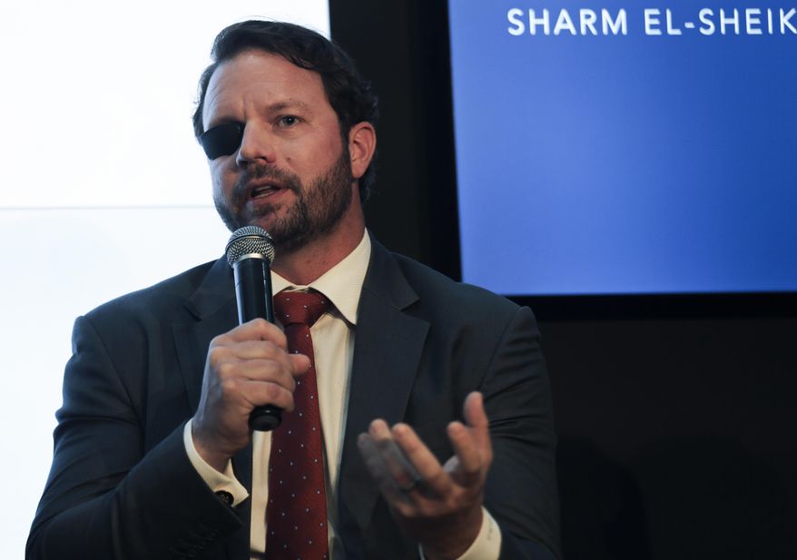 U.S. Rep. Dan Crenshaw, R-Texas, attends a panel discussion titled Conservative Solutions to Global Climate Challenges: A Robust U.S. Energy, Climate and Conservation Agenda, in the U.S. Pavilion at the COP27 U.N. Climate Summit, in Sharm el-Sheikh, Egypt, Friday, Nov. 11, 2022. (AP Photo/Thomas Hartwell)