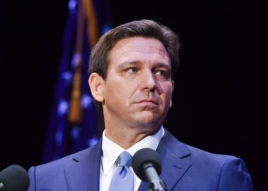 Florida&#x27;s Republican Gov. Ron DeSantis takes to the stage to debate his Democratic opponent Charlie Crist in Fort Pierce, Fla., on Oct. 24, 2022. Both DeSantis a Republican and California Gov. Gavin Newsom, a Democrat said their reelection victories were in part because of their commitment to freedom. But the governors have vastly different definitions of what freedom means. (Crystal Vander Weit/TCPalm.com via AP, Pool) **FILE**