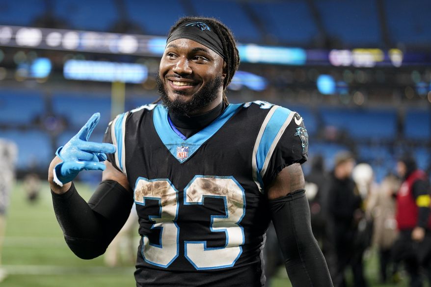 Carolina Panthers running back D&#x27;Onta Foreman smiles after their win against the Atlanta Falcons in an NFL football game on Thursday, Nov. 10, 2022, in Charlotte, N.C. (AP Photo/Jacob Kupferman)