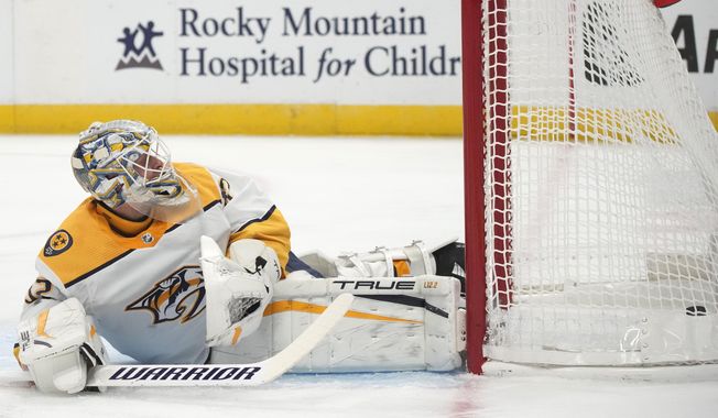 Nashville Predators goaltender Kevin Lankinen reacts after giving up a power-play goal to Colorado Avalanche right wing Mikko Rantanen during the first period of an HL hockey game Thursday, Nov. 10, 2022, in Denver. (AP Photo/David Zalubowski)