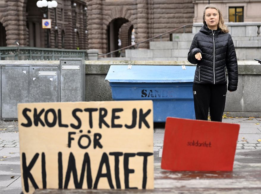 Climate activist Greta Thunberg attends the weekly Fridays for Future demonstration at the Mynttorget square next to the Swedish Parliament Riksdagen, in Stockholm, Sweden, Friday, Nov. 11, 2022. (Pontus Lundahl/TT News Agency via AP)